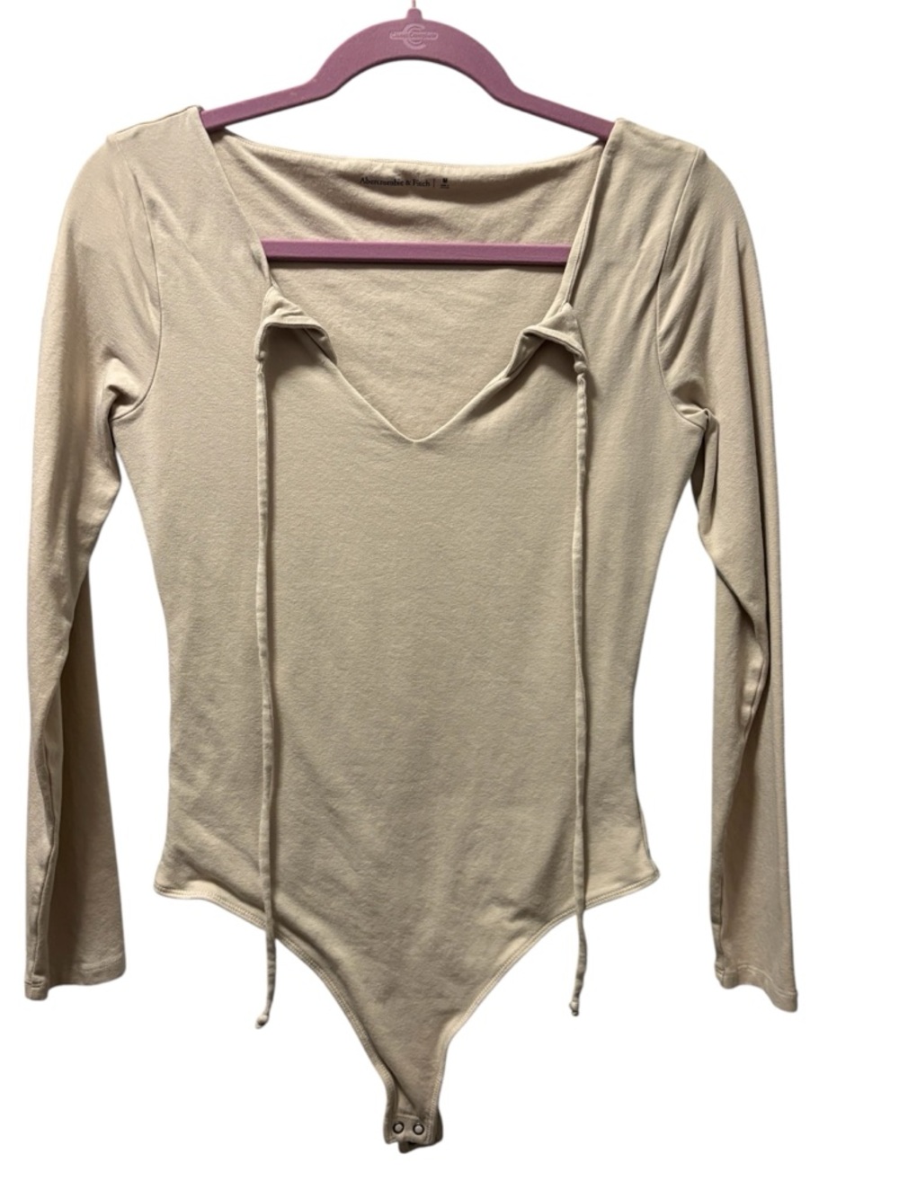Abercrombie & Fitch Long-Sleeve V-Neck Tie-Front Bodysuit in Cream
